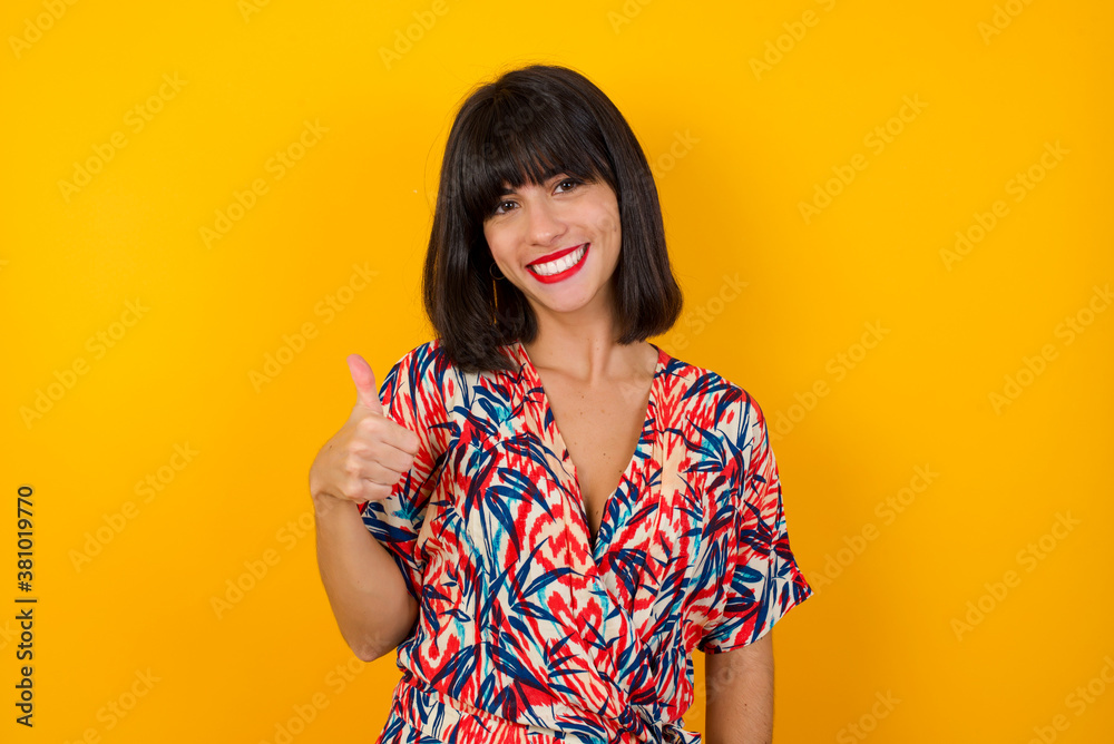 Good job! Portrait of a happy smiling blue eyed young successful woman giving thumb up gesture standing outdoors. Positive human emotion facial expression body language. Funny girl Good job! Portrait of a happy smiling blue eyed young successful woman giving thumb up gesture standing outdoors. Positive human emotion facial expression body language. Funny girl