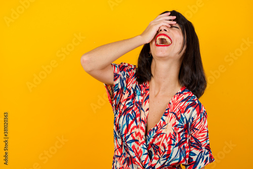 Charismatic carefree joyful friendly-looking outgoing woman likes laugh out loud not hiding emotions giggling hear funny hilarious joke chuckling facepalm close eyes smiling broadly white background