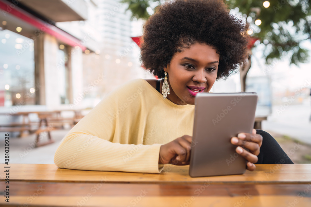 Afro american latin woman using digital tablet Afro american latin woman using digital tablet