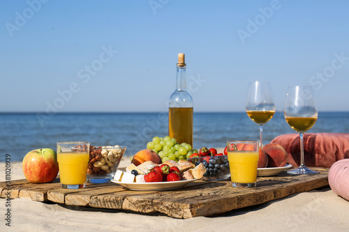 Food and drinks on beach. Summer picnic