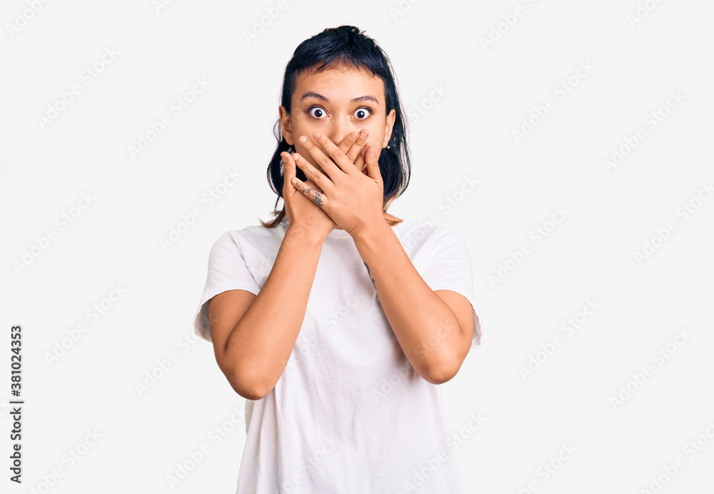 Young woman wearing casual clothes shocked covering mouth with hands for mistake. secret concept. Young woman wearing casual clothes shocked covering mouth with hands for mistake. secret concept.