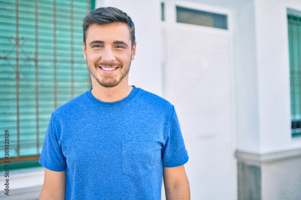 Young caucasian man smiling happy walking at the city. Young caucasian man smiling happy walking at the city.