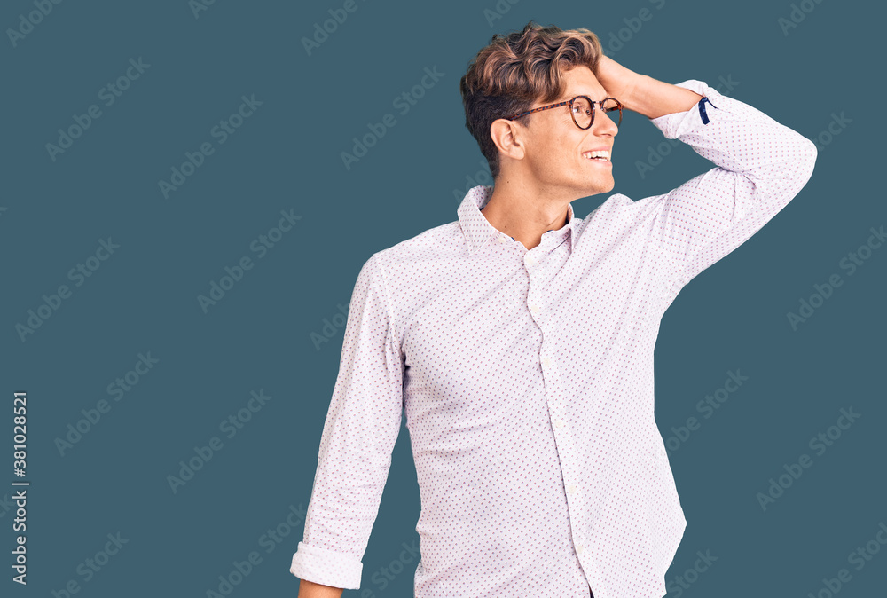 Young handsome man wearing business clothes and glasses smiling confident touching hair with hand up gesture, posing attractive and fashionable Young handsome man wearing business clothes and glasses smiling confident touching hair with hand up gesture, posing attractive and fashionable