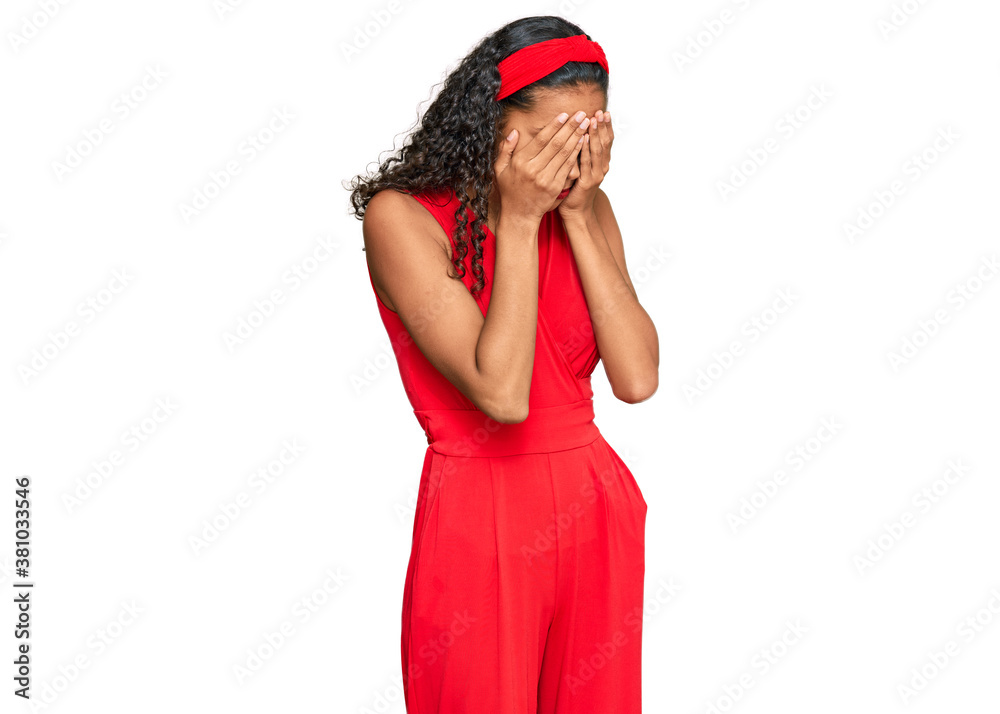 Young african american girl wearing elegant and sexy look with sad expression covering face with hands while crying. depression concept. Young african american girl wearing elegant and sexy look with sad expression covering face with hands while crying. depression concept.