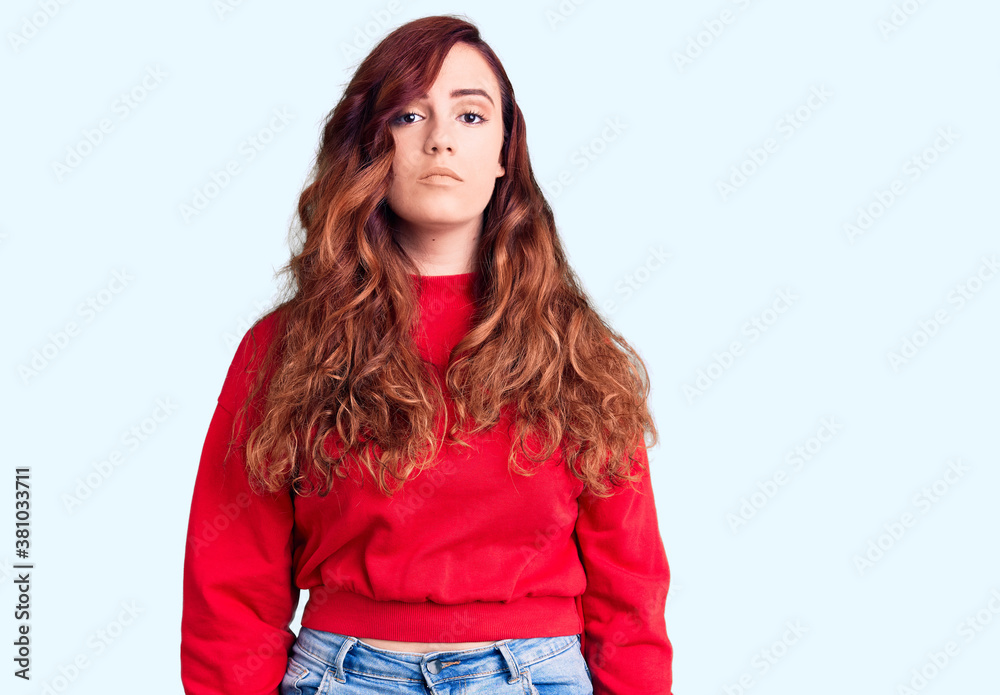Young beautiful woman wearing casual winter sweater relaxed with serious expression on face. simple and natural looking at the camera. Young beautiful woman wearing casual winter sweater relaxed with serious expression on face. simple and natural looking at the camera.