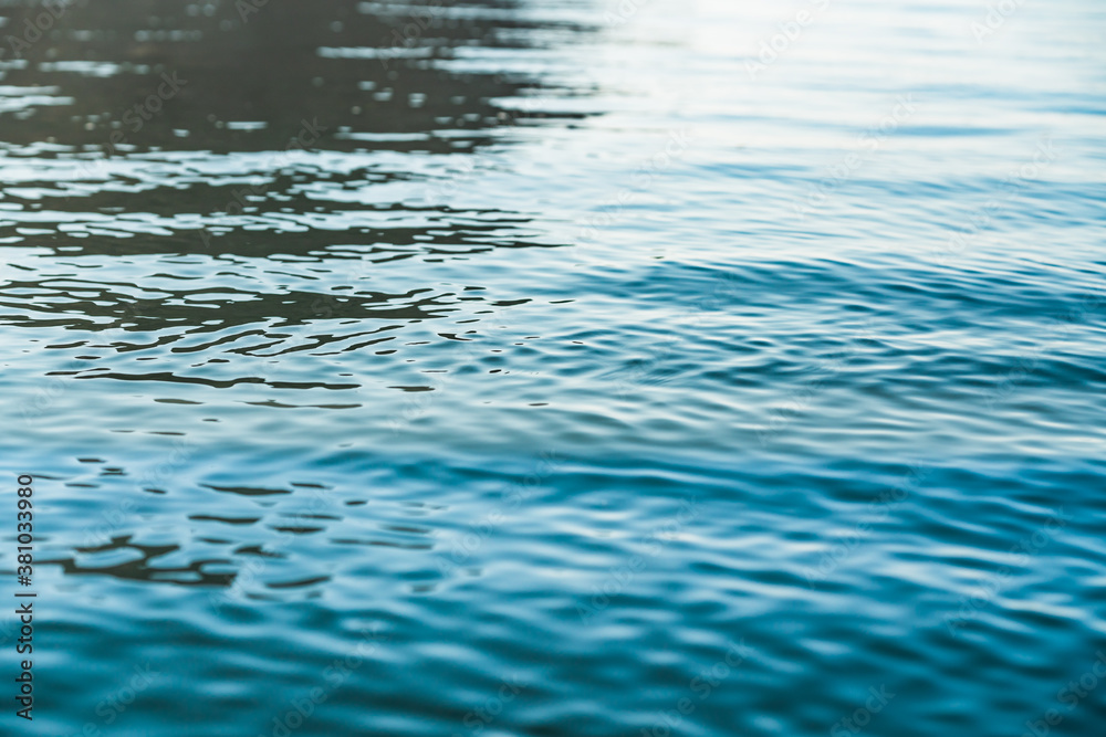Water surface background. Quiet sea with beautiful sun reflections Water surface background. Quiet sea with beautiful sun reflections
