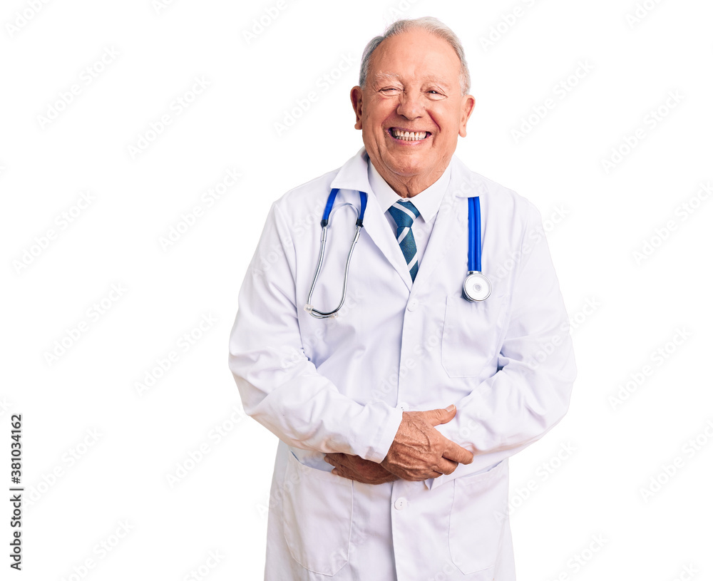 Senior handsome grey-haired man wearing doctor coat and stethoscope smiling and laughing hard out loud because funny crazy joke with hands on body. Senior handsome grey-haired man wearing doctor coat and stethoscope smiling and laughing hard out loud because funny crazy joke with hands on body.