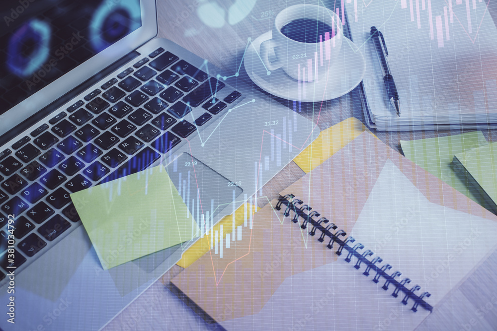 Multi exposure of forex graph drawing and desktop with coffee and items on table background. Concept of financial market trading Multi exposure of forex graph drawing and desktop with coffee and items on table background. Concept of financial market trading