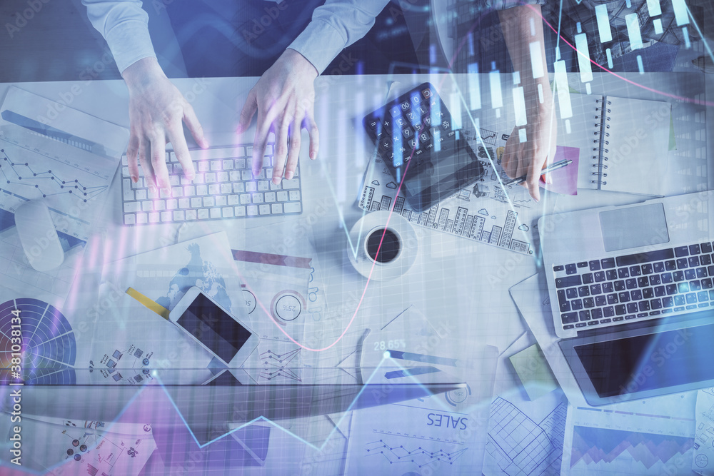 Double exposure of man and woman working together and financial chart hologram drawing. market analysis concept. Computer background. Top View. Double exposure of man and woman working together and financial chart hologram drawing. market analysis concept. Computer background. Top View.
