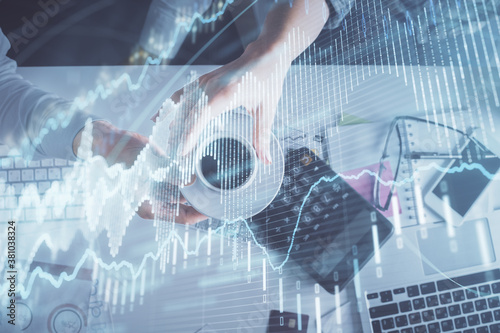 Wallpaper Mural Double exposure of man and woman working together and financial chart hologram drawing. market analysis concept. Computer background. Top View. Torontodigital.ca
