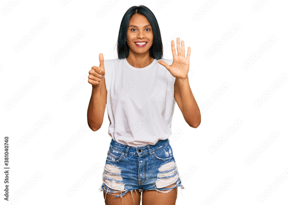 Young african american woman wearing casual clothes showing and pointing up with fingers number six while smiling confident and happy. Young african american woman wearing casual clothes showing and pointing up with fingers number six while smiling confident and happy.