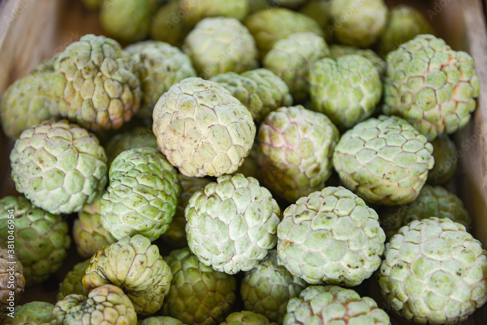 Sugar apple on wooden box in the fruit market Asian - Annona sweetsop or or custard apple Sugar apple on wooden box in the fruit market Asian - Annona sweetsop or or custard apple
