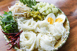 Thailand food vermicelli noodle boiled eggs and fresh vegetables on plate served wooden table - Thai rice noodles