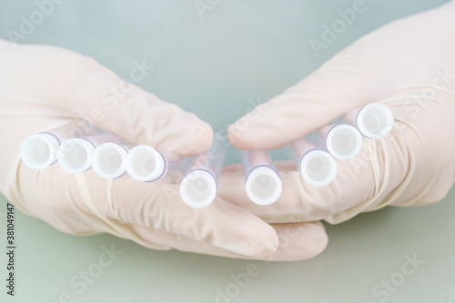Scientist analyzing holding test tube in laboratory