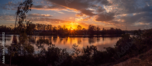 Beautiful Riverside Sunset Panorama with Reflections