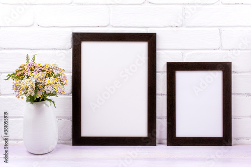 Two black poster frames mockup with pink yarrow © TasiPas