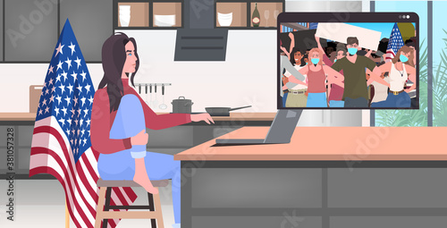 woman using laptop watching online video people in masks holding usa flags labor day celebration coronavirus quarantine self isolation concept kitchen interior full length horizontal vector