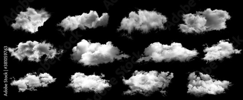 Set of white clouds isolated on black background. © Angkana
