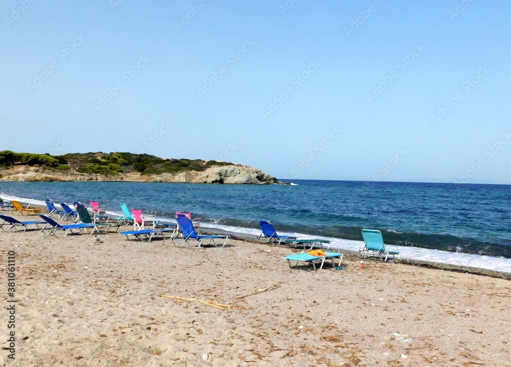 A colorful beach on the coast of Attica, Greece, waiting for guests on a summer day A colorful beach on the coast of Attica, Greece, waiting for guests on a summer day