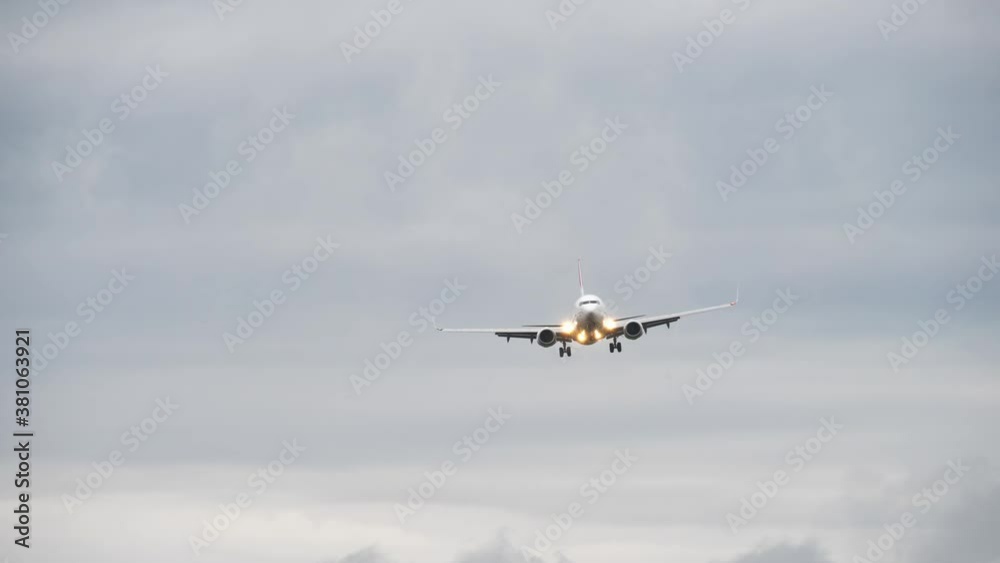 Airliner on final approach. View from the runway's edge Airliner on final approach. View from the runway's edge