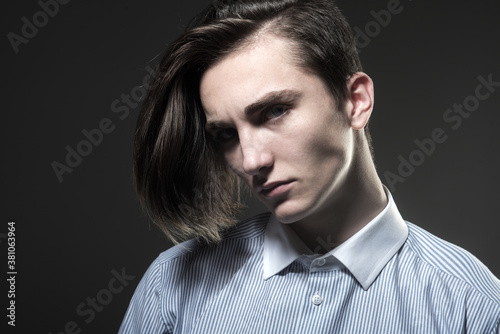 Portrait of stylish handsome young man. Fashion guy. Male beauty concept. Stylish haircut, hairstyle. Hair style.