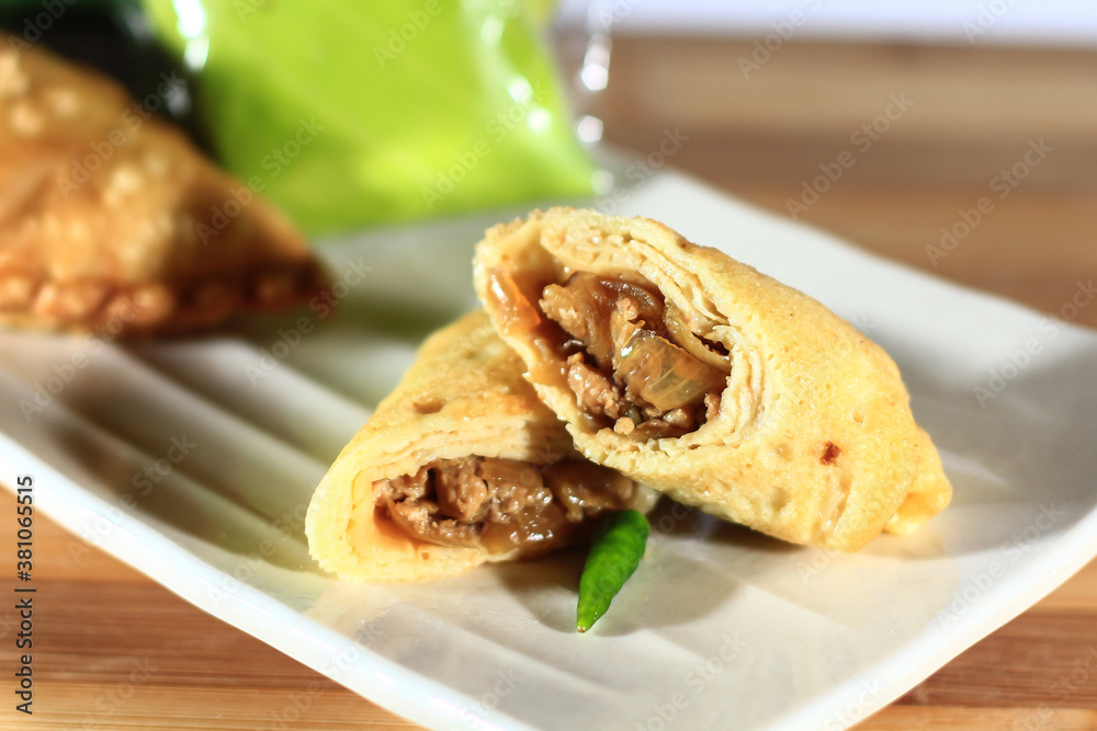 Solo sausage is a typical food from Solo, Central Java province, which is made from ground beef or chicken and then wrapped in egg omelette. Bokeh shot. Solo sausage is a typical food from Solo, Central Java province, which is made from ground beef or chicken and then wrapped in egg omelette. Bokeh shot.