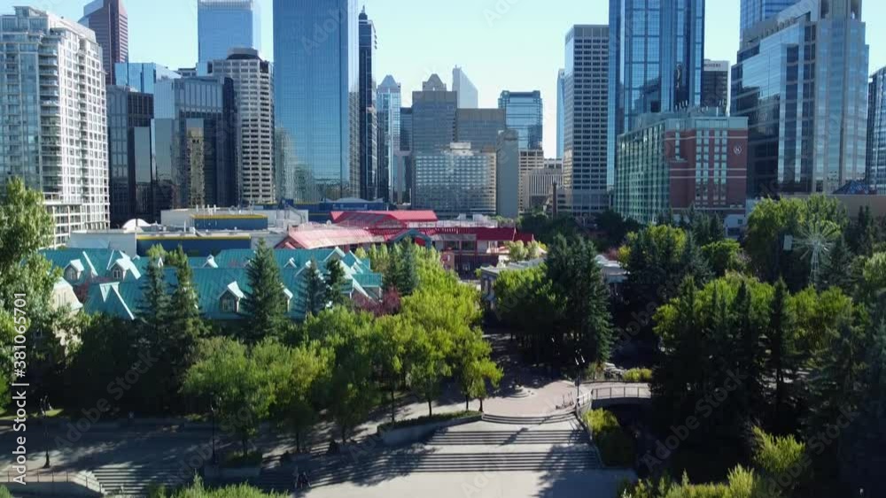 Aerial of Prince's Island Park fountain rising up to reveal downtown Calgary Aerial of Prince's Island Park fountain rising up to reveal downtown Calgary