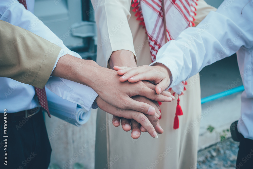 Hands close-up of arab engineer and businessman.
