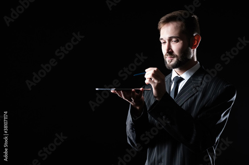 Businessman with tablet on ...