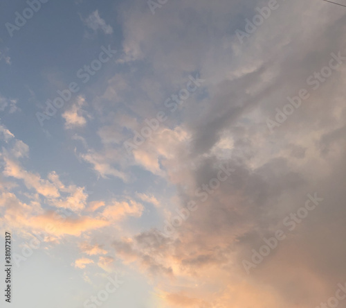 Sunset sky with clouds and sun