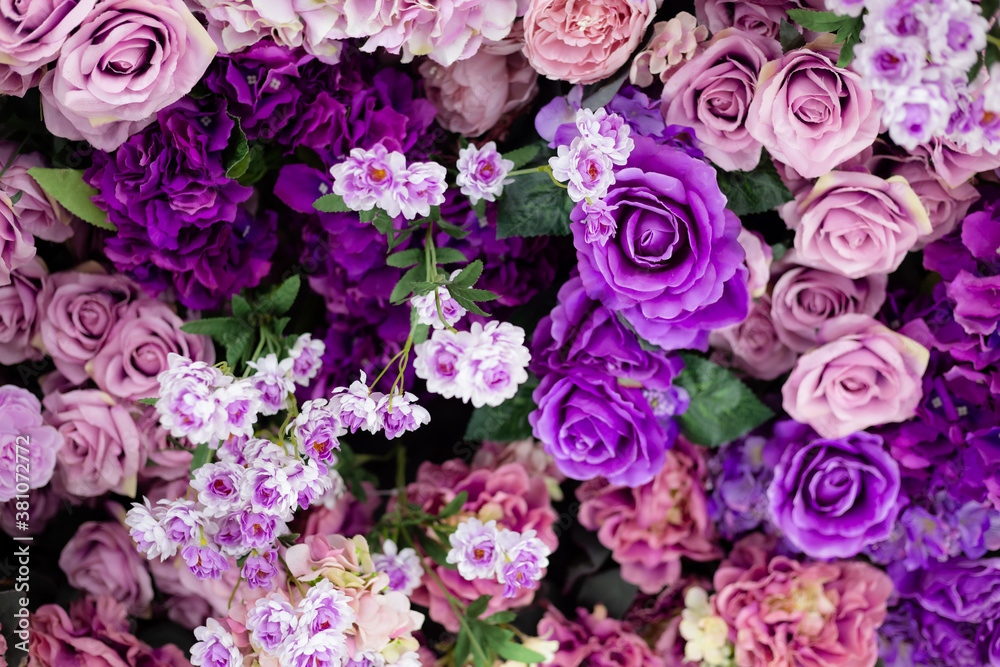 Closeup image of beautiful flowers wall background with amazing colorful roses. Top view