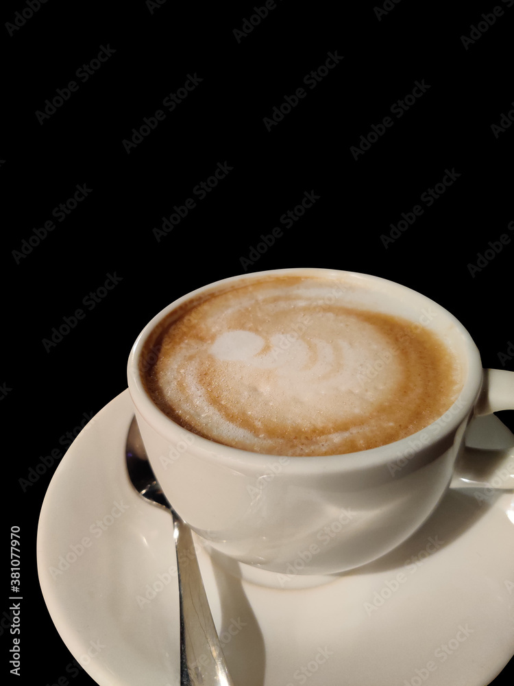 A cup of Coffee with black background. A cup of Coffee with black background.