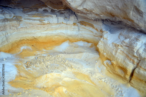 Layers of colored sand. Snow white quartz sand. Shore of Blue Lake in the Chernigow region, Ukraine.Former quarry of quartz sand for glass production.Popular local resort at present