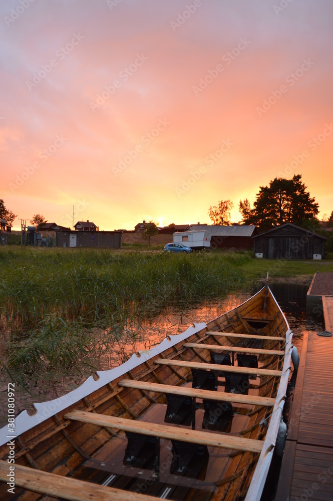 Stunning red and purple sunset and rainbows over Dalarna County in Sweden