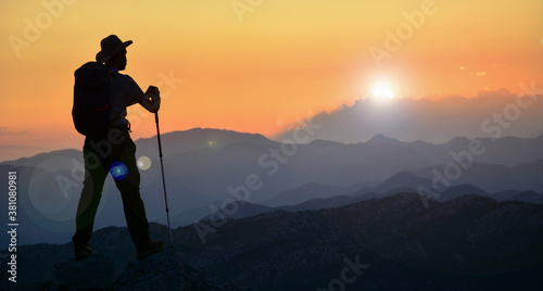magnificent sunset, mountain climber watching, diving in peace