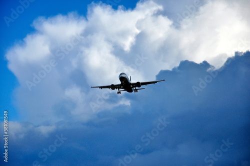 Landing aircraft against the background of clouds.