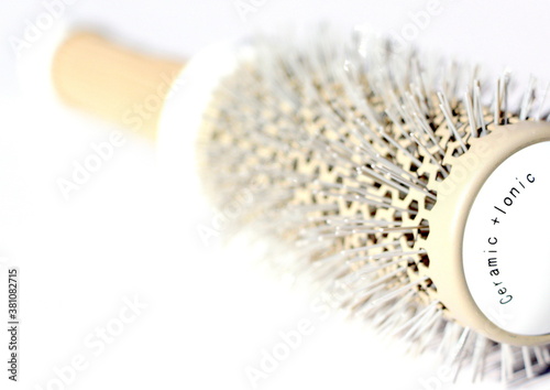 Brushing comb for styling and straightening hair. Professional tool for a hairdresser stylist.