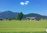landscape with grass and houses in Austria mountain at sunny day