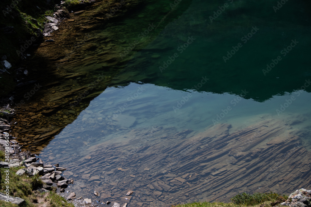 Fototapeta premium Clear water in the mountain lake 