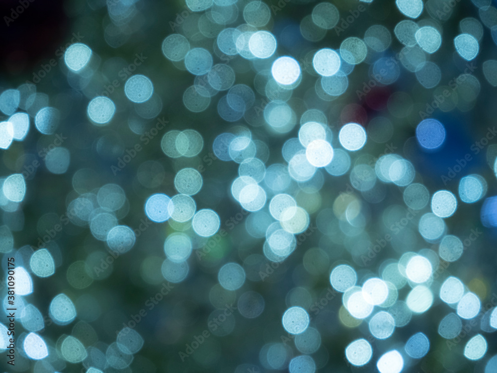 Christmas and new year lights. Blurred lights of blue color. Can be used as background and texture
