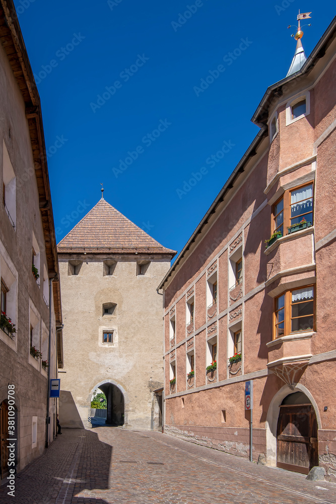 Fototapeta premium Via Malles, one of the main streets in the historic center of Glurns, leading up to the north gate, South Tyrol, Italy
