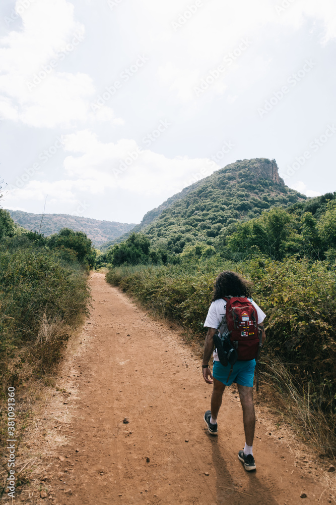 a person traveler walking in the wild 