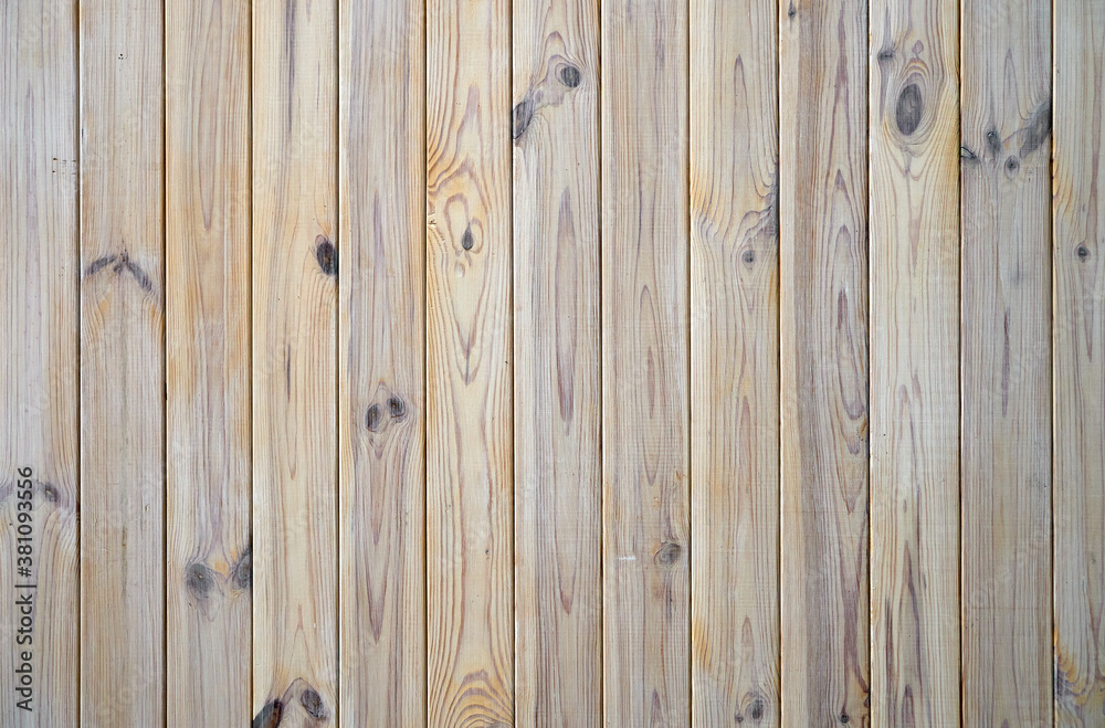 Naklejka premium Light gray polished wooden planks fastened together. Natural wood texture for background or interior, empty template. Concept of carpentry, woodwork production. Close up, top view.