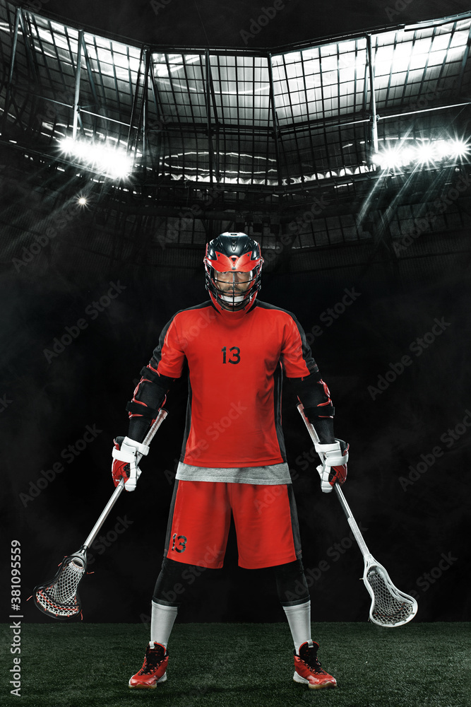Fotka „Lacrosse Player, athlete sportsman in red helmet on grand arena  background. Sport and motivation wallpaper.“ ze služby Stock | Adobe Stock