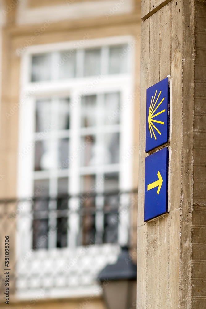 way of st james in Coruna city to Compostela english way with yellow scallop and arrow signs way of st james in Coruna city to Compostela english way with yellow scallop and arrow signs