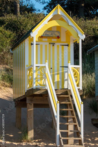 Yellow and white beach chalet on the beach