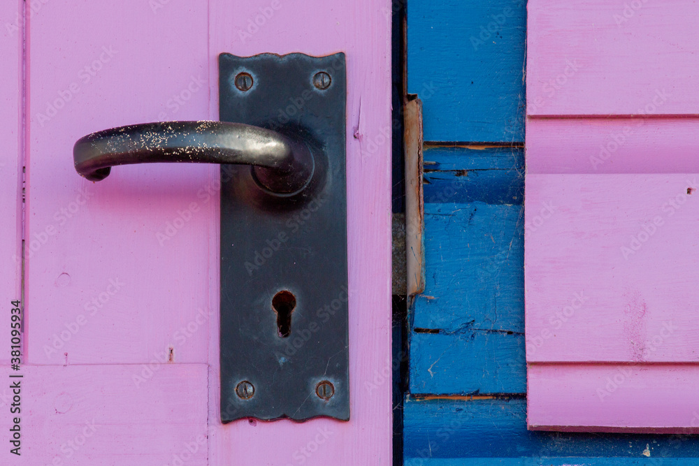 old pink door with close up of door handle old pink door with close up of door handle