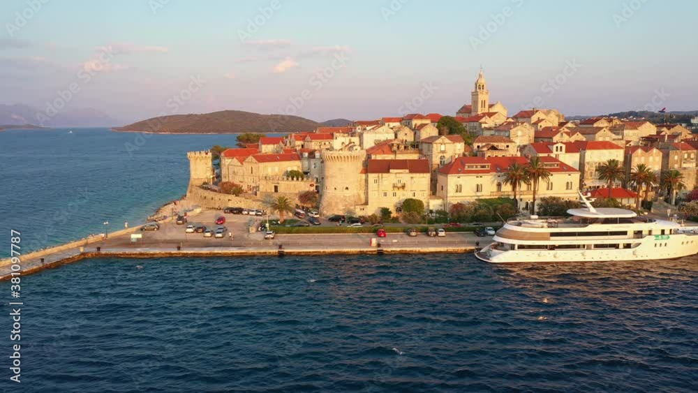 Aerial view of the Korcula old town in Croatia by the Adriatic sea in the Balkans, shot with a slide or traveling motion Aerial view of the Korcula old town in Croatia by the Adriatic sea in the Balkans, shot with a slide or traveling motion