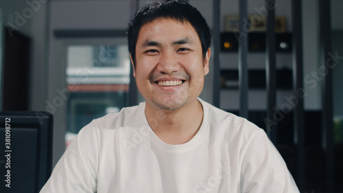 Фотография Portrait Asian Chinese man feeling happy funny at home