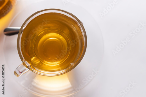 Top-view a cup of freshly brewed hot tea on the white background